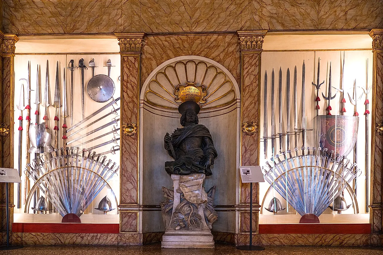 The Armoury of the Doge's Palace, with fans of spears, halberds and swords displayed on the walls