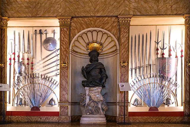 The Armoury of the Doge's Palace, with fans of spears, halberds and swords displayed on the walls