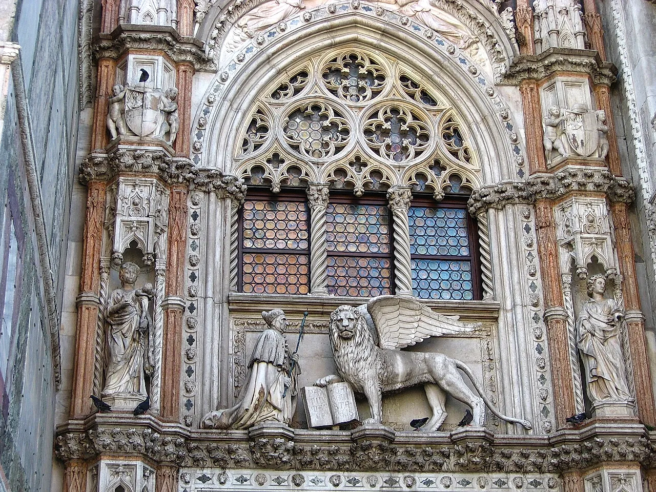 The Porta della Carta, the ornate Gothic gateway of the Doge's Palace, with the winged lion of St Mark above the entrance